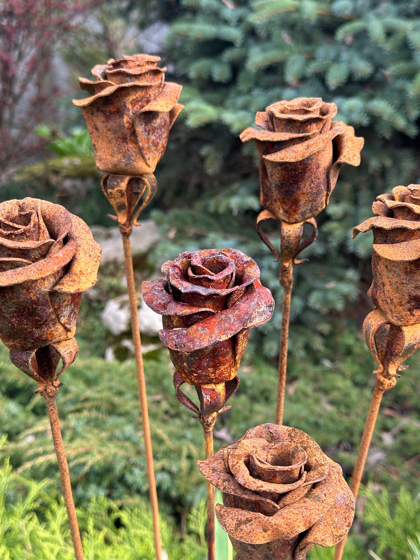 Six Rusty metal flowers - about 35” (90 cm) high and 4” (10 cm) in diameter. Weight is around 0,3 lbs (350 gr) each.