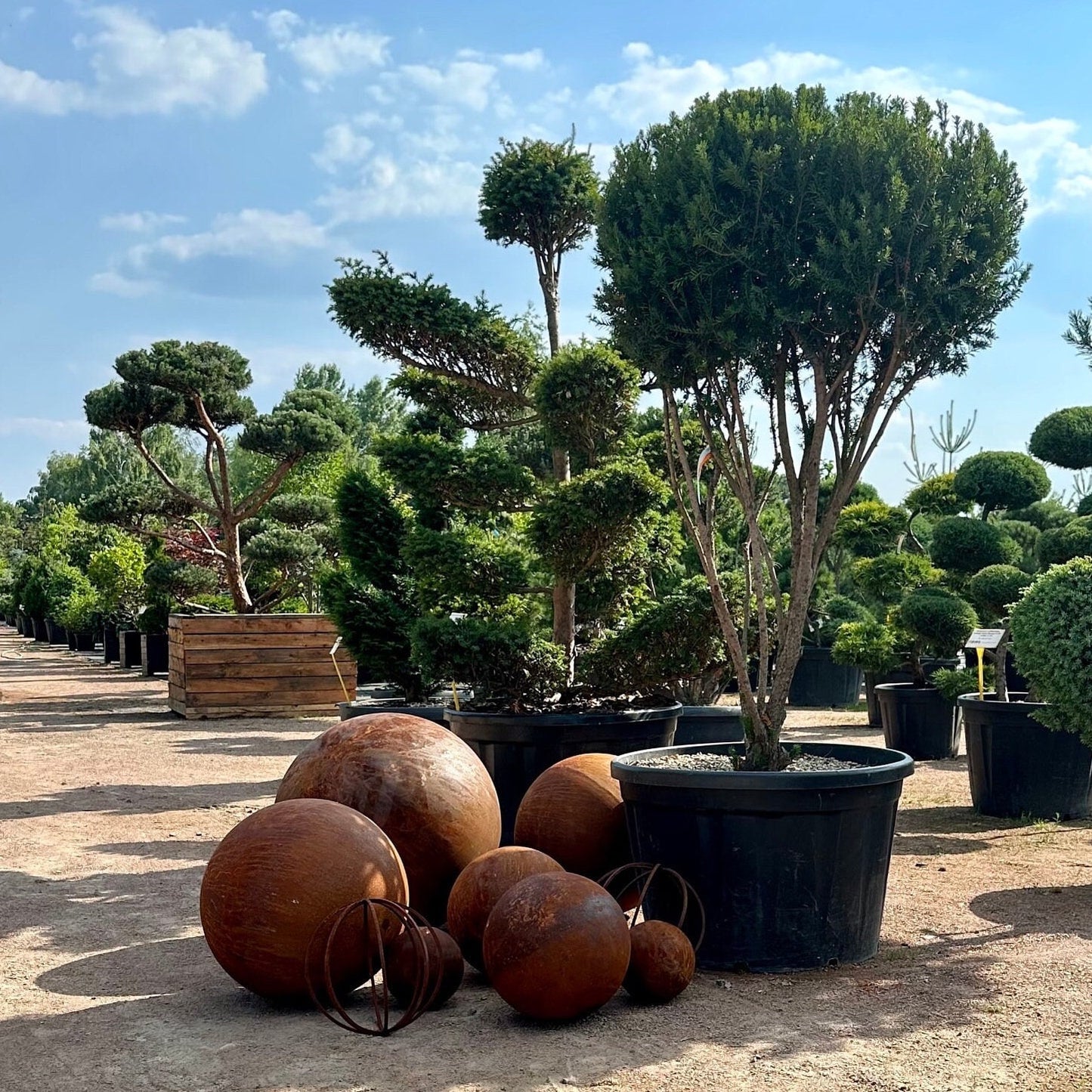 Big set of nine rusty metal spheres 27”, 20”, 14” and 8” in diameter - Contemporary Minimalistic Outdoor Garden Globes