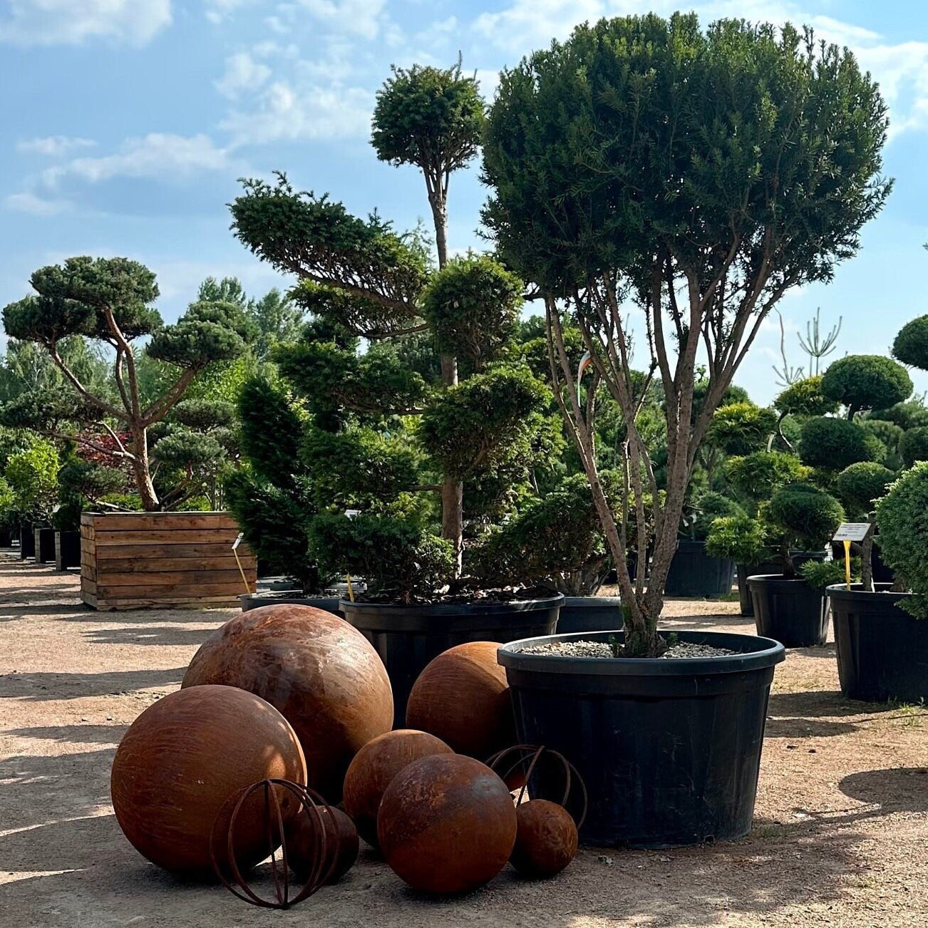 Big set of nine rusty metal spheres 27”, 20”, 14” and 8” in diameter - Contemporary Minimalistic Outdoor Garden Globes