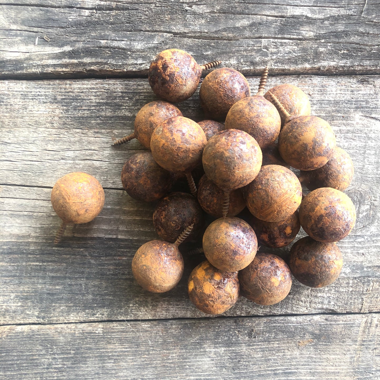 Fifty handmade rusted metal balls with screw attachment in sizes from 1.2 to 3.9 inches - unique decor for walls or fencing