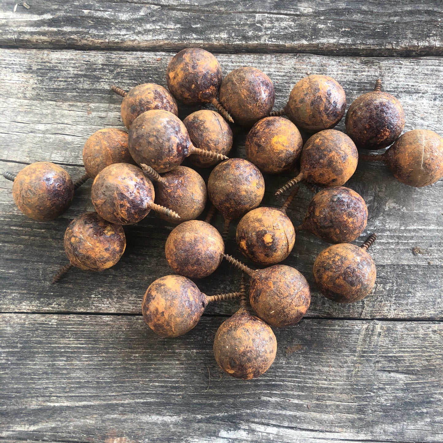 Fifty handmade rusted metal balls with screw attachment in sizes from 1.2 to 3.9 inches - unique decor for walls or fencing