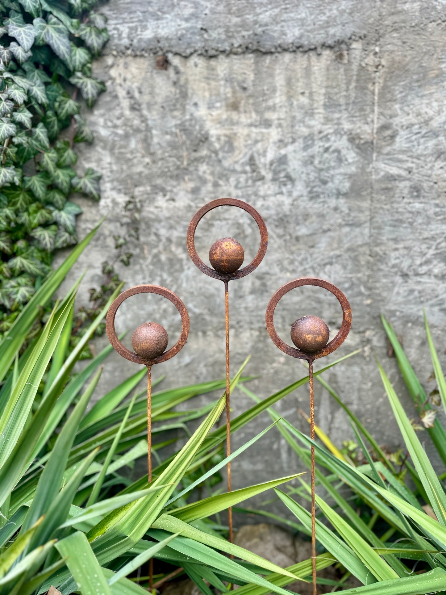 Set of 3 Rusty Metal Garden Stakes and Finials: Rustic Outdoor Metal Decor for Your Garden.