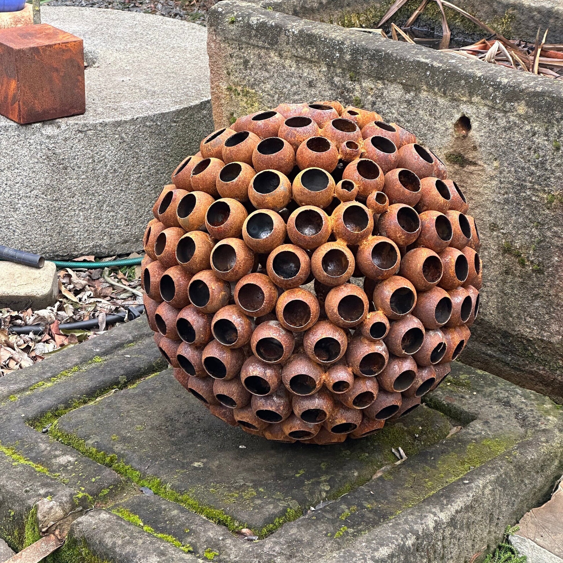 This Big 20” Abstract Rusty metal ball sculpture will place decorative accent in the garden compositions and landscape, create an atmosphere of romance and coziness in your home and become an awesome piece of rusty metal art.